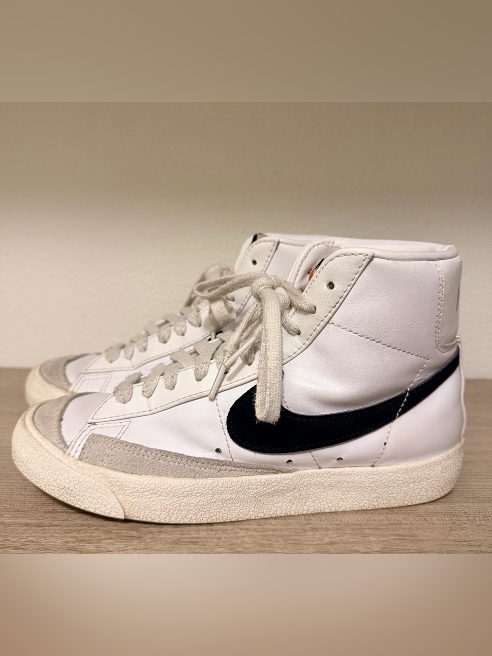 Nike White High-Top Sneakers with Black Swoosh